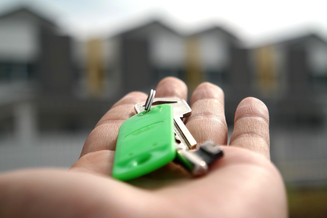 House keys changing hands at a closing